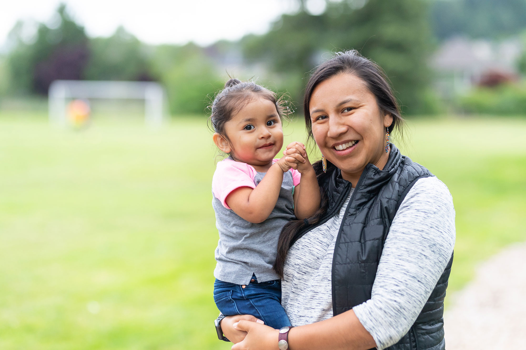 Portrait of a Native American mother and daughter outside
